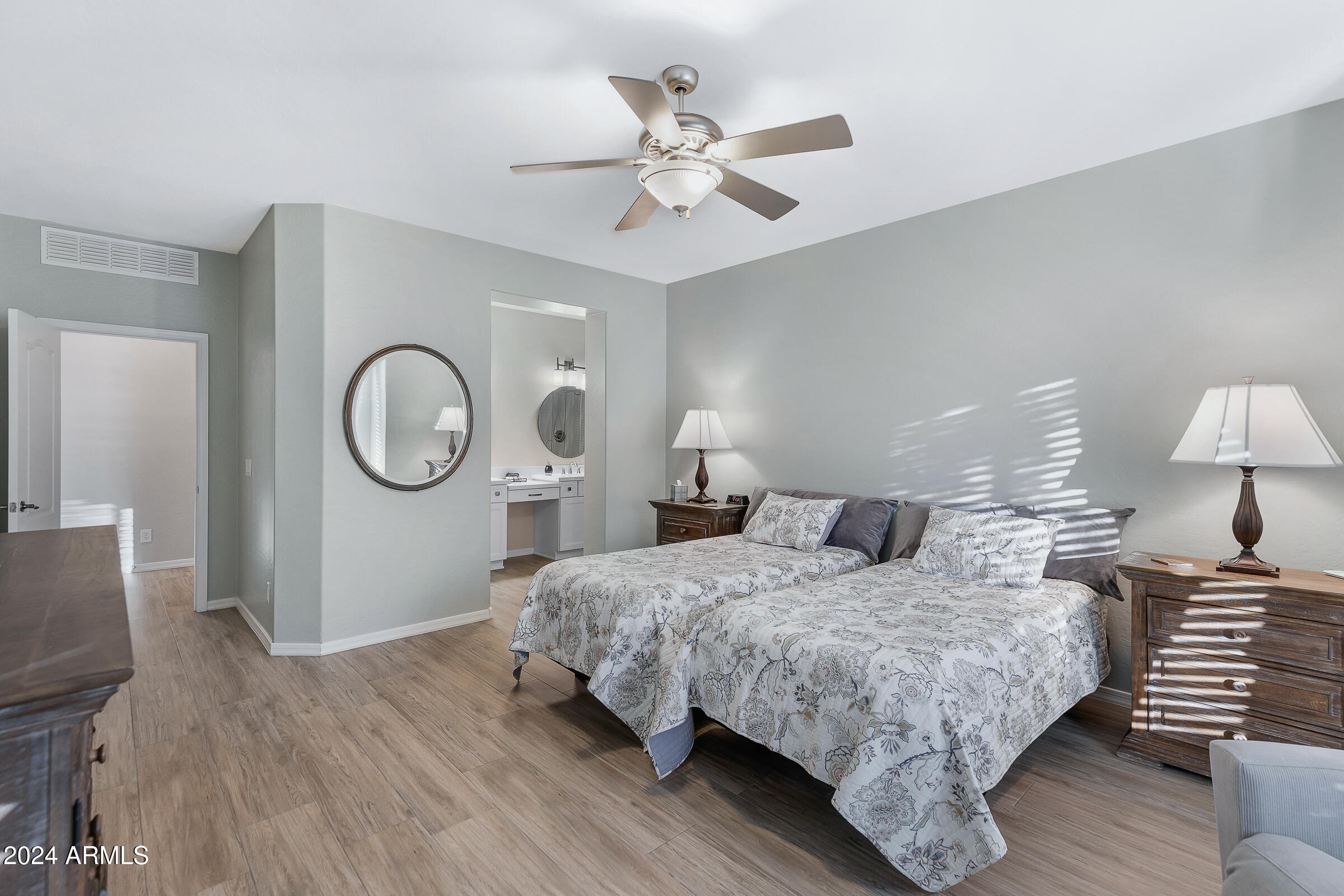 4741 East Timberline Road Gilbert, AZ 85297 - Photo 18 of 44 a bedroom with a bed and wooden floor