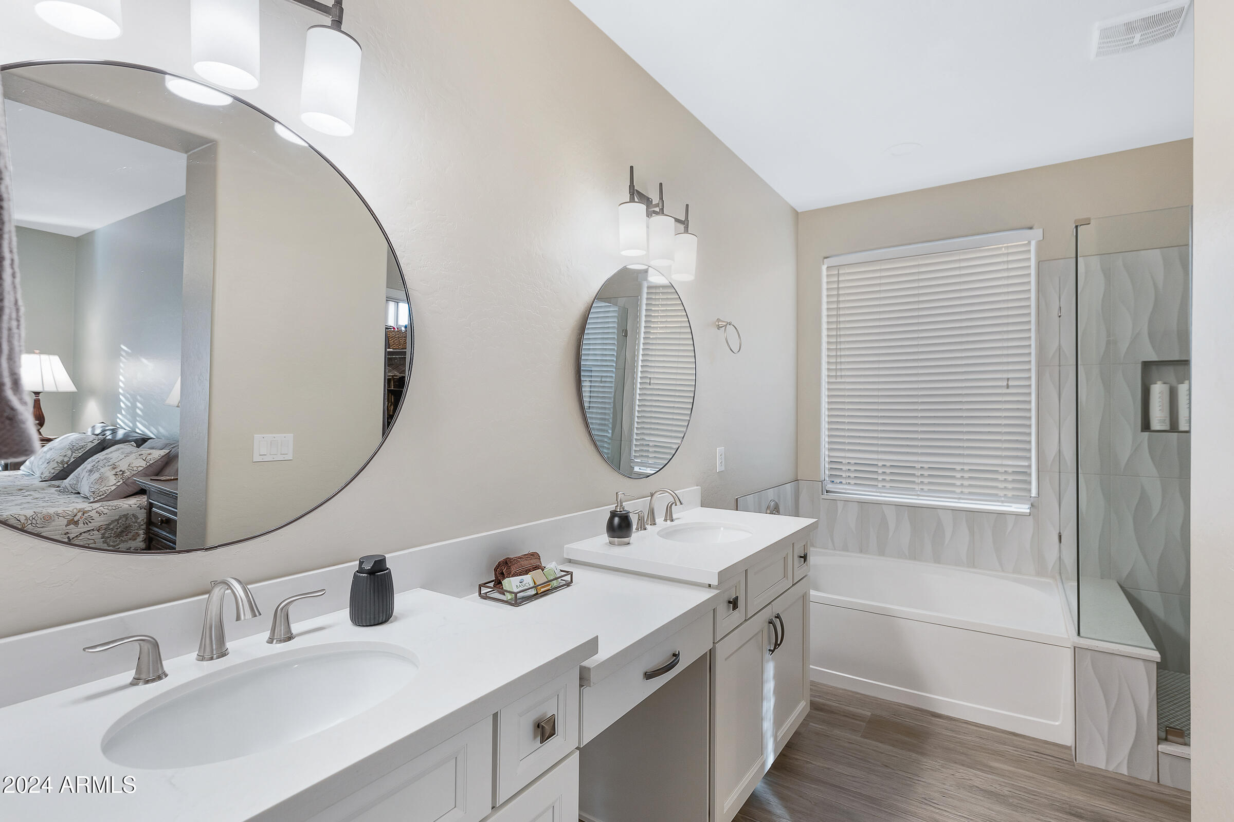 4741 East Timberline Road Gilbert, AZ 85297 - Photo 19 of 44 a bathroom with a double vanity sink mirror and bathtub