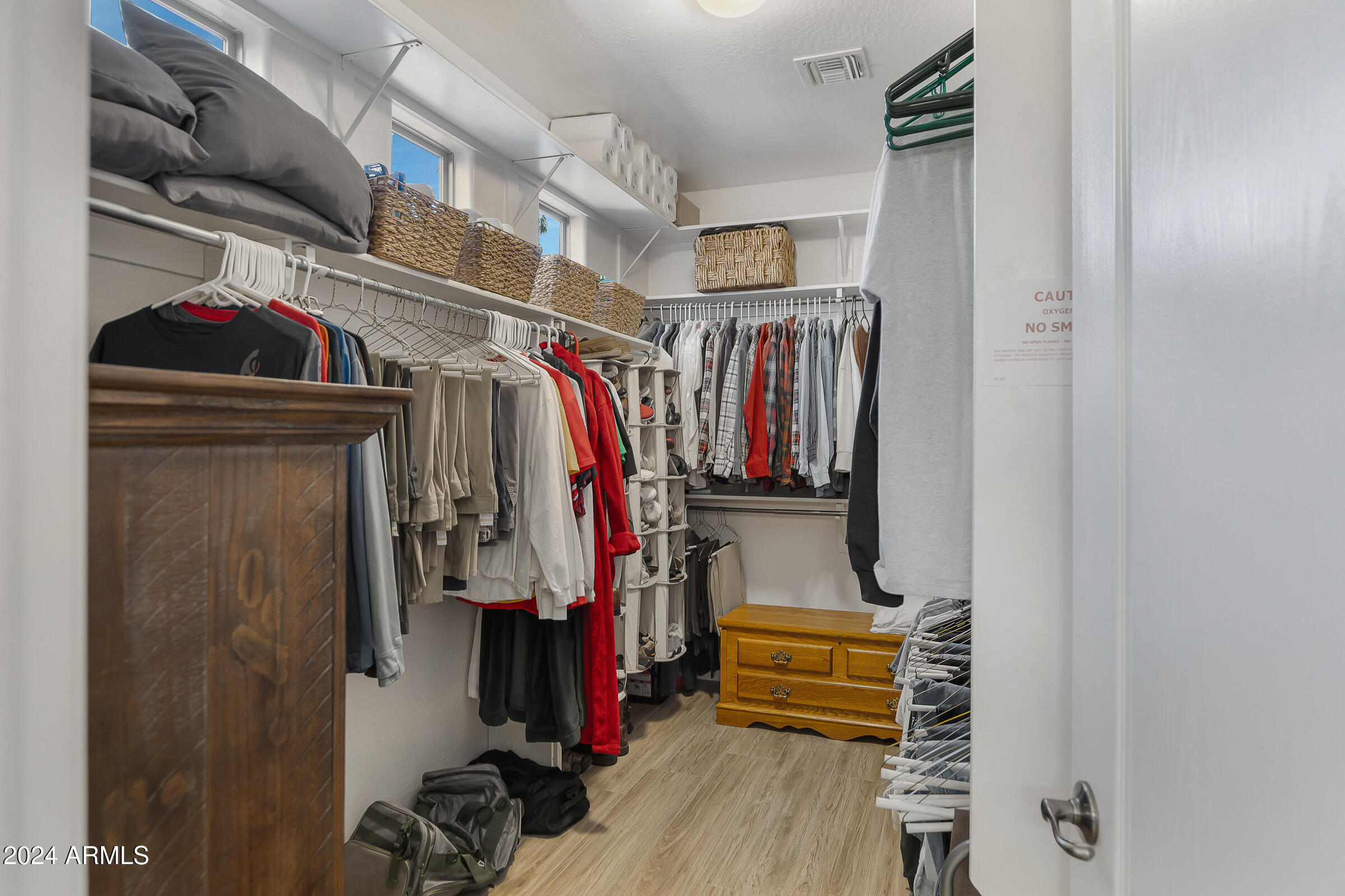 4741 East Timberline Road Gilbert, AZ 85297 - Photo 22 of 44 a view of walk in closet with clothes and shoes