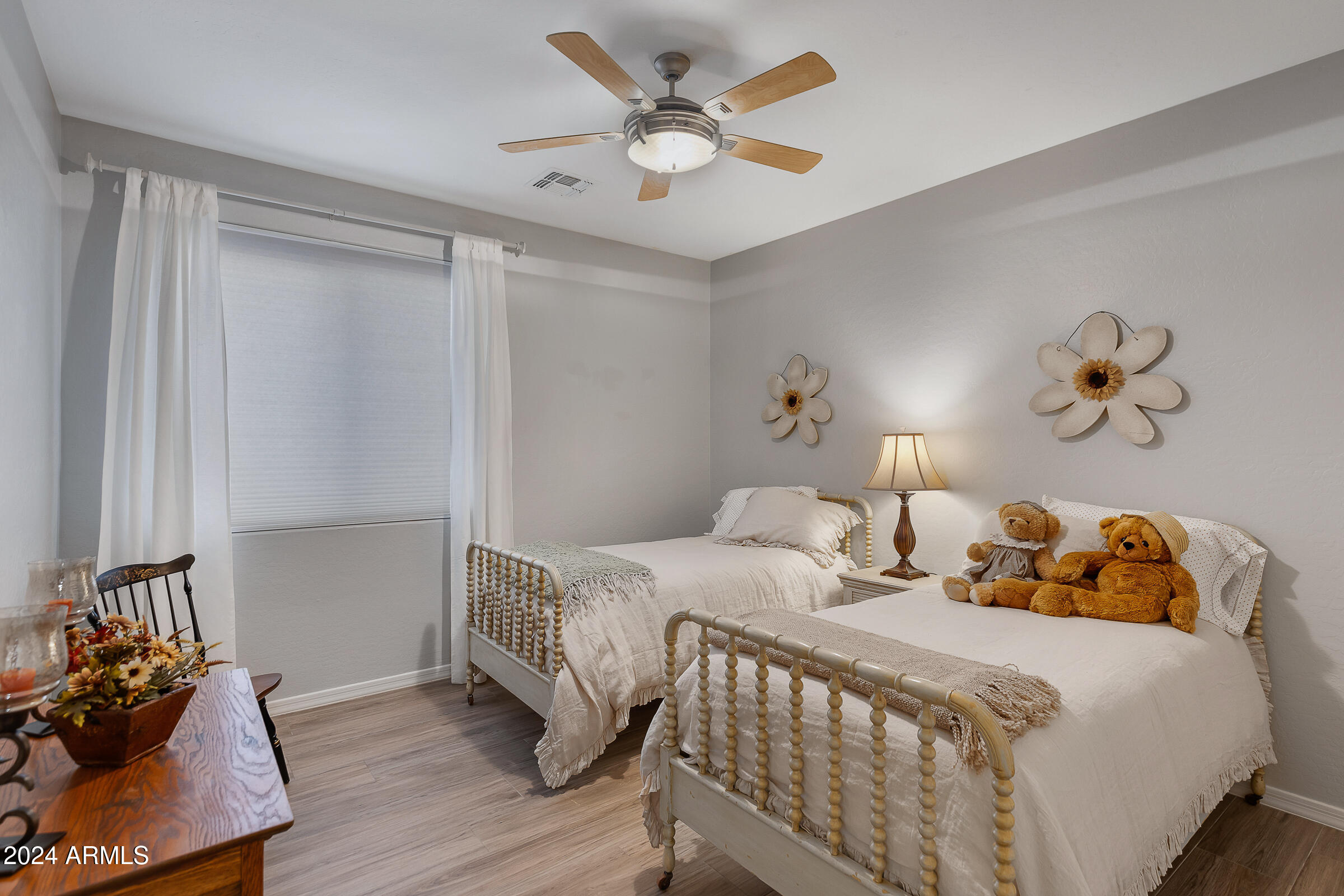 4741 East Timberline Road Gilbert, AZ 85297 - Photo 25 of 44 a bedroom with a bed and a chandelier
