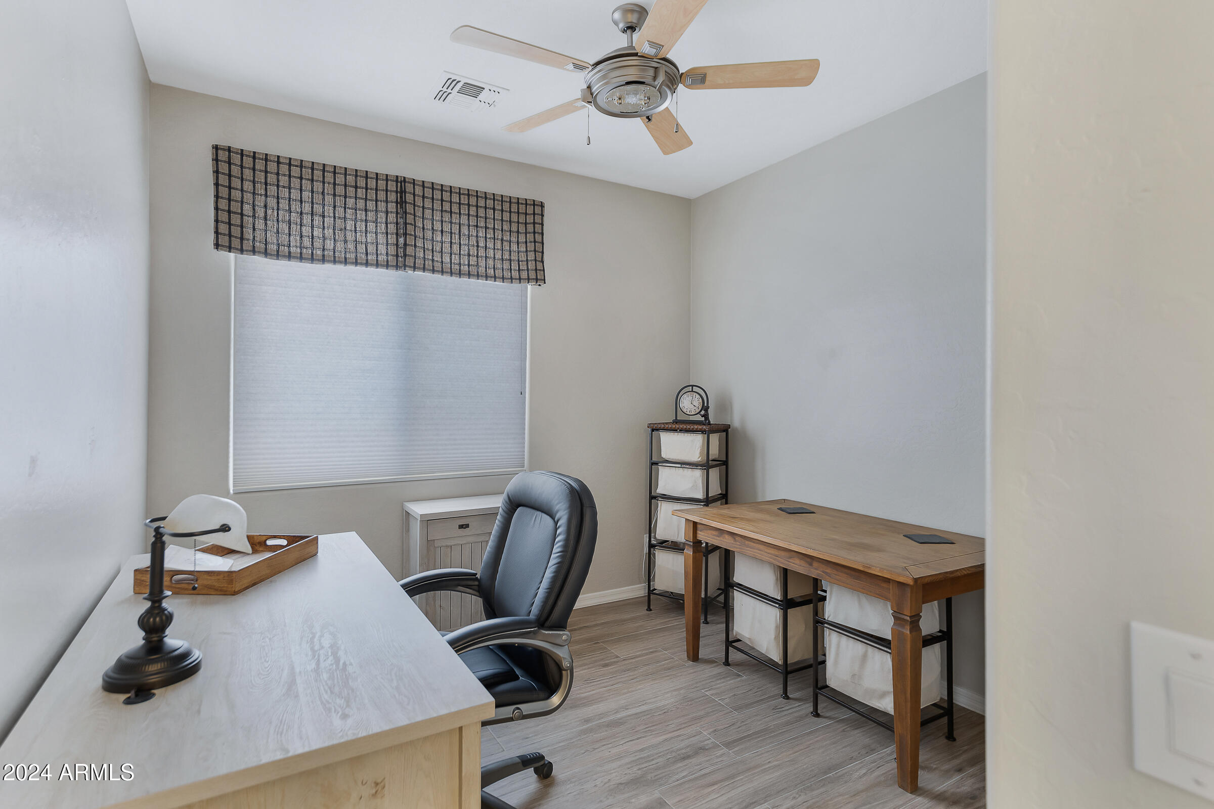 4741 East Timberline Road Gilbert, AZ 85297 - Photo 26 of 44 a view of a workspace with furniture and wooden floor