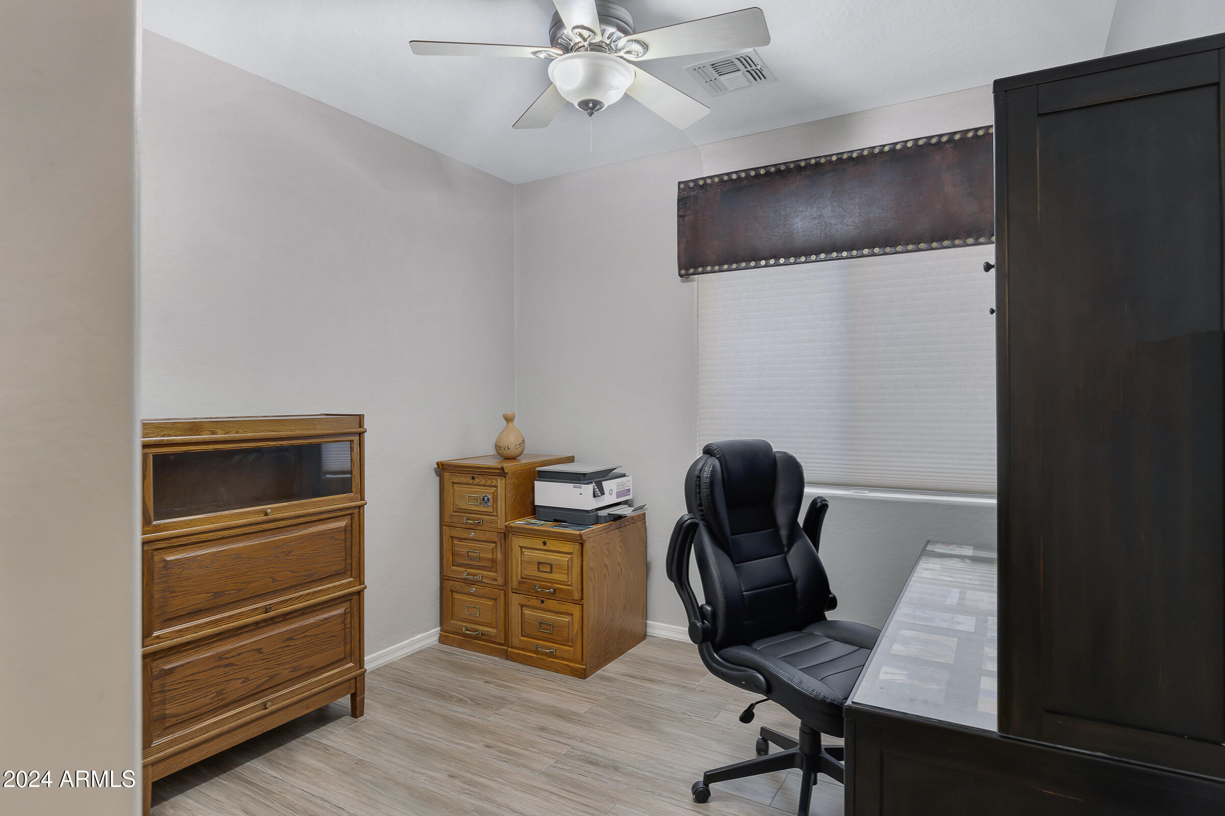 4741 East Timberline Road Gilbert, AZ 85297 - Photo 27 of 44 a view of workspace with wooden floor windows