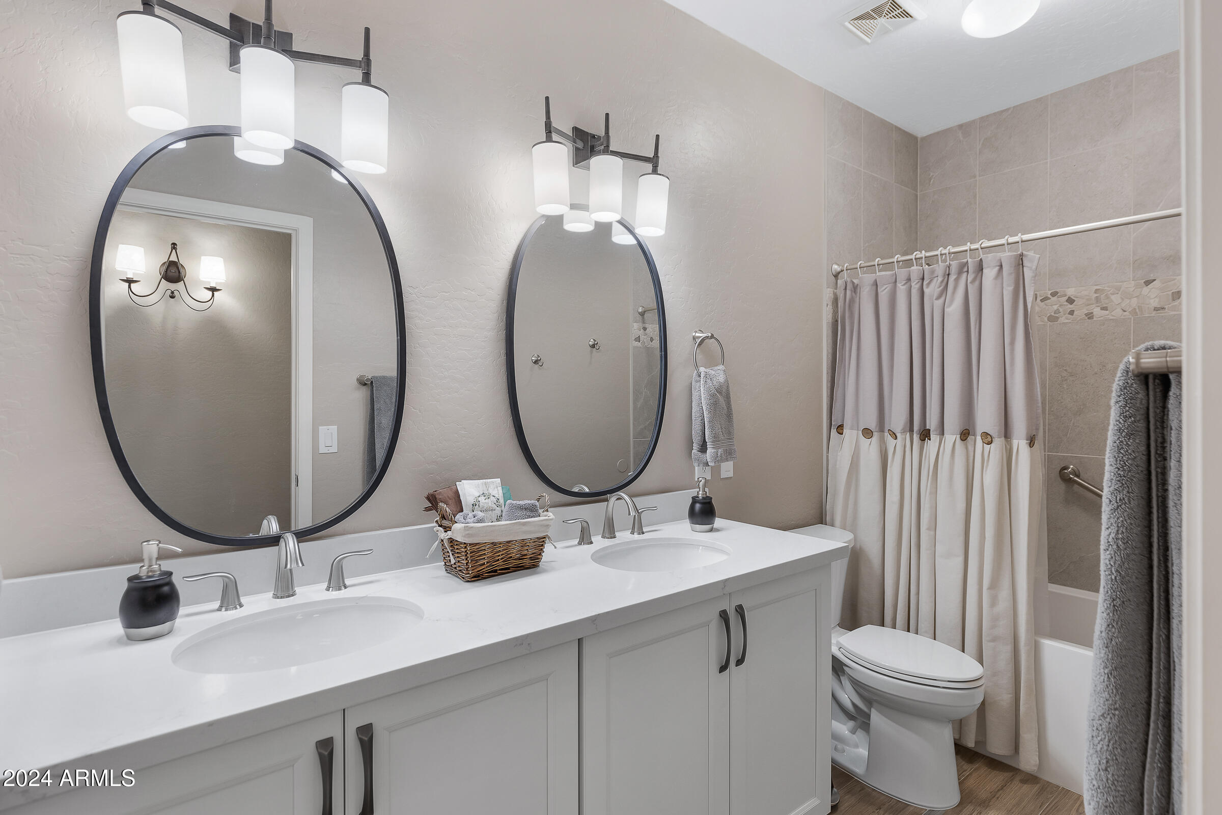 4741 East Timberline Road Gilbert, AZ 85297 - Photo 28 of 44 a bathroom with a double vanity sink and a mirror