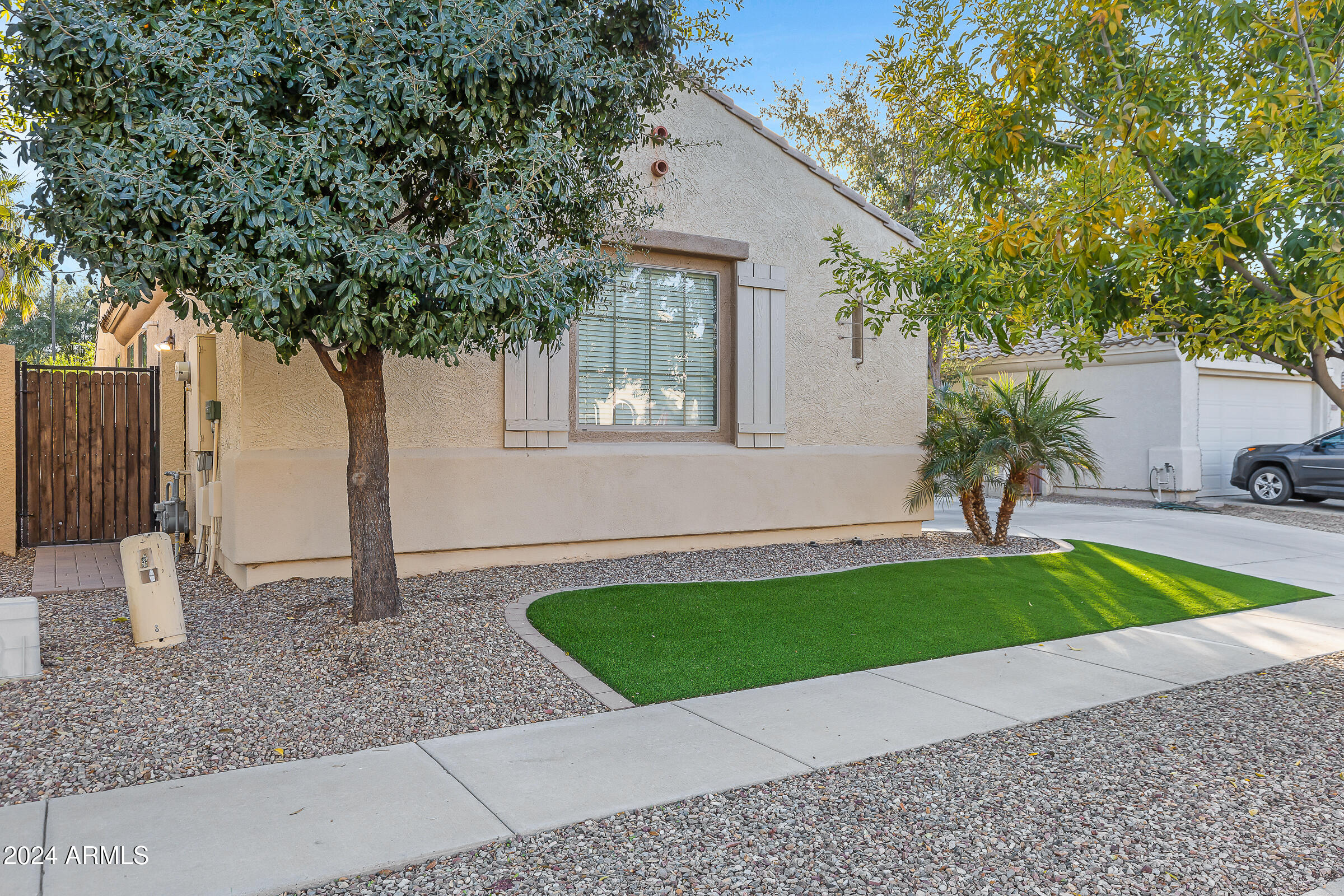 4741 East Timberline Road Gilbert, AZ 85297 - Photo 3 of 44 a view of a house with a backyard and a tree