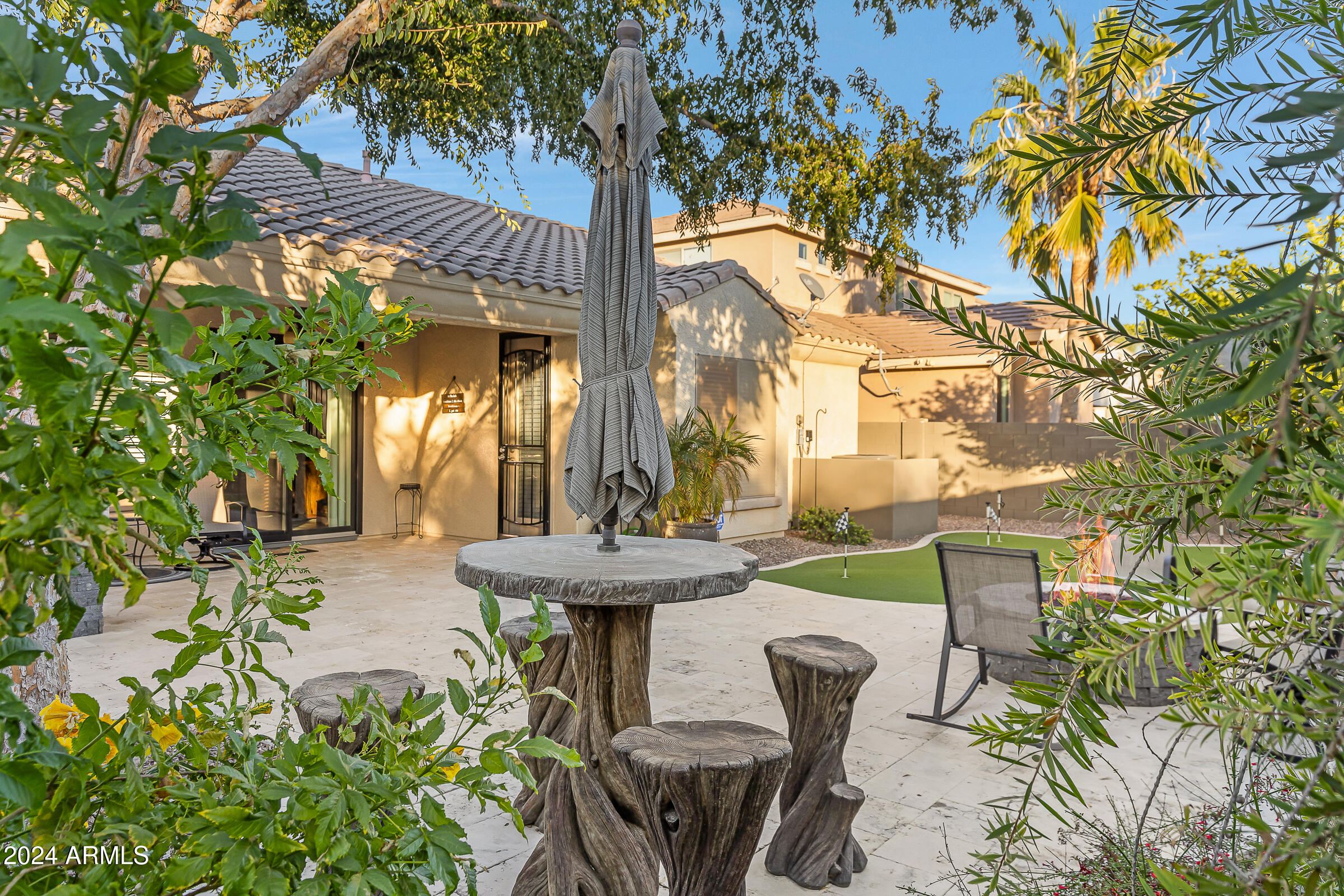 4741 East Timberline Road Gilbert, AZ 85297 - Photo 40 of 44 a view of a table and chairs in patio with a fire pit