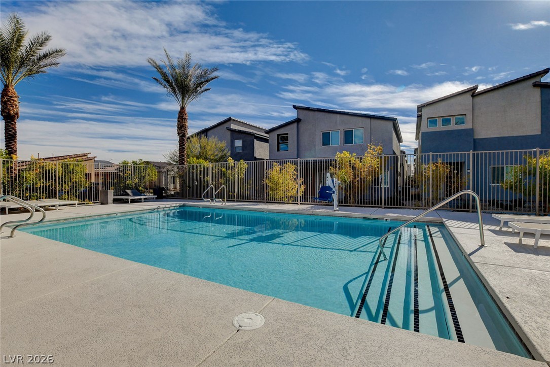 7330 North Decatur Boulevard, Unit 6 North Las Vegas, NV 89084 - Photo 26 of 42 An inviting community pool awaits, perfect for leisurely afternoons under the desert sun.