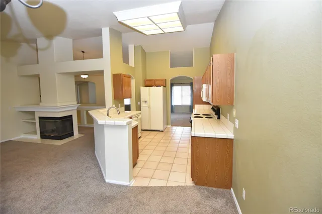 a view of living room with furniture and fireplace