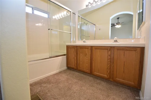 a bathroom with a double vanity sink and mirror