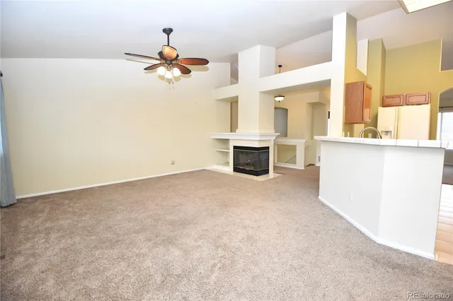 a view of a kitchen with a sink cabinet and a window