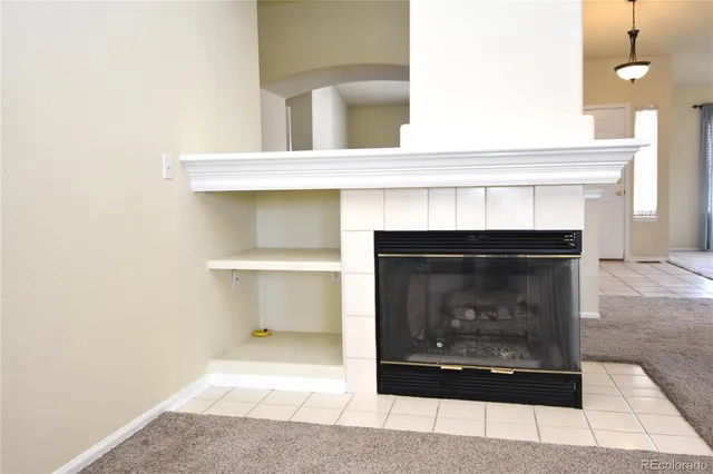 a living room with a fireplace