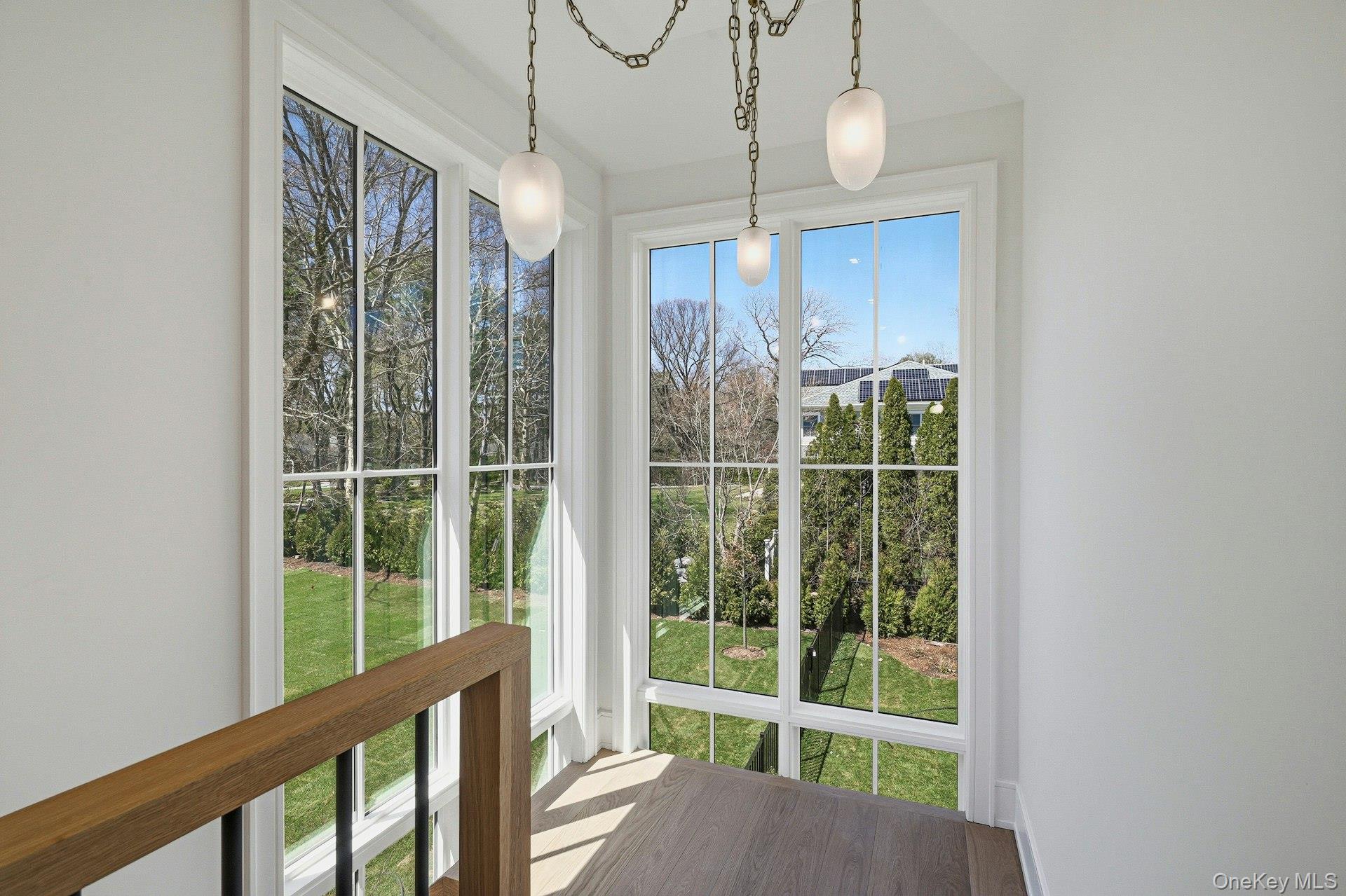 25 West Creek Farms Road Sands Point, NY 11050 - Photo 22 of 39 a view of a room with balcony and floor to ceiling windows