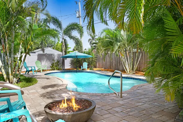 a view of a swimming pool with a patio