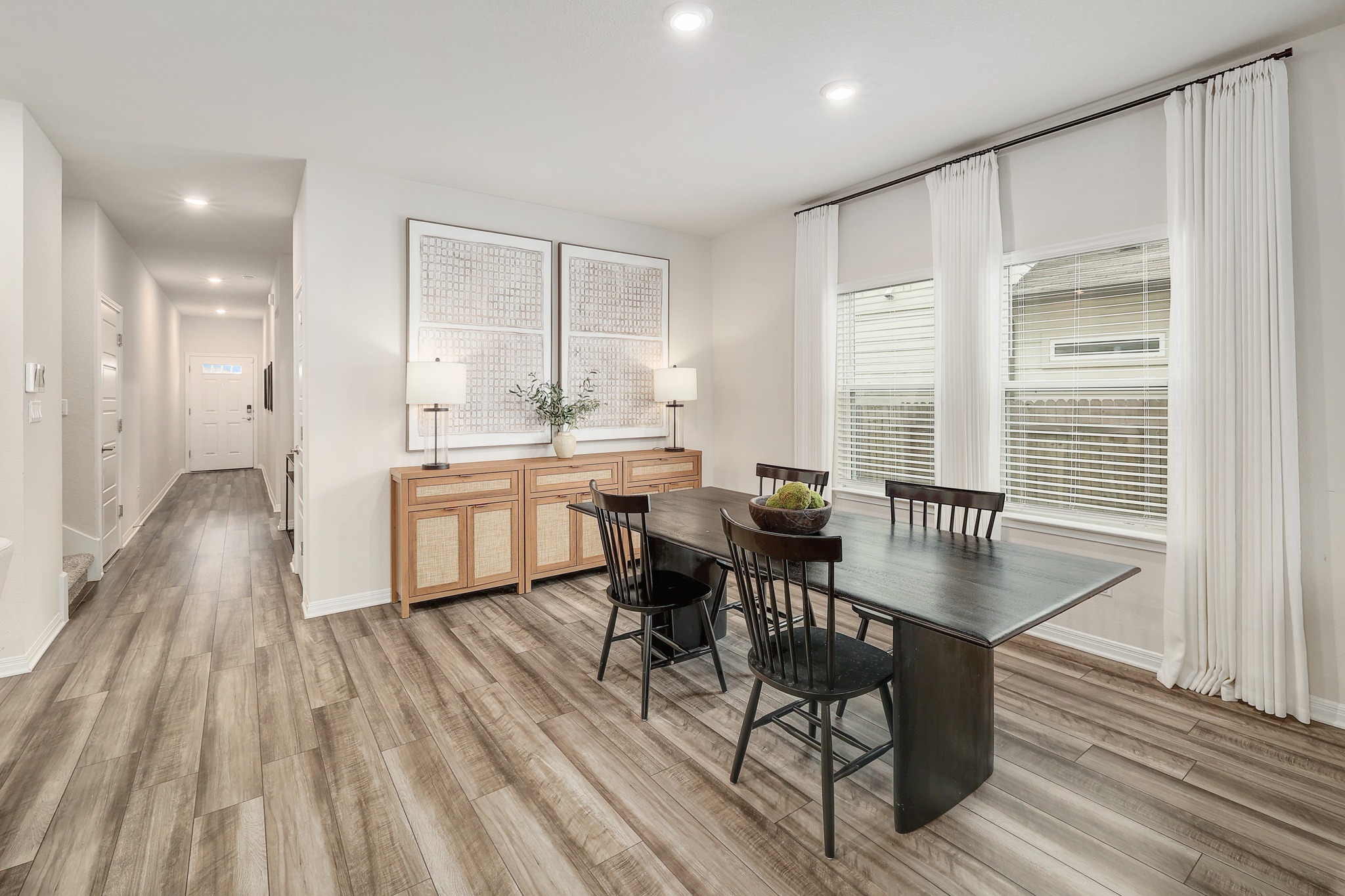 144 Sungrove Trail Georgetown, TX 78628 - Photo 5 of 40 The dining area offers lots of natural light and window treatments can convey
