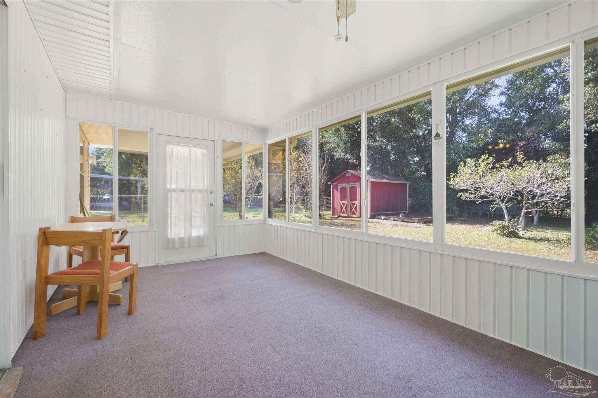 4327 Chantilly Way Milton, FL 32583 - Photo 19 of 32 wooden floor in an empty room with a window