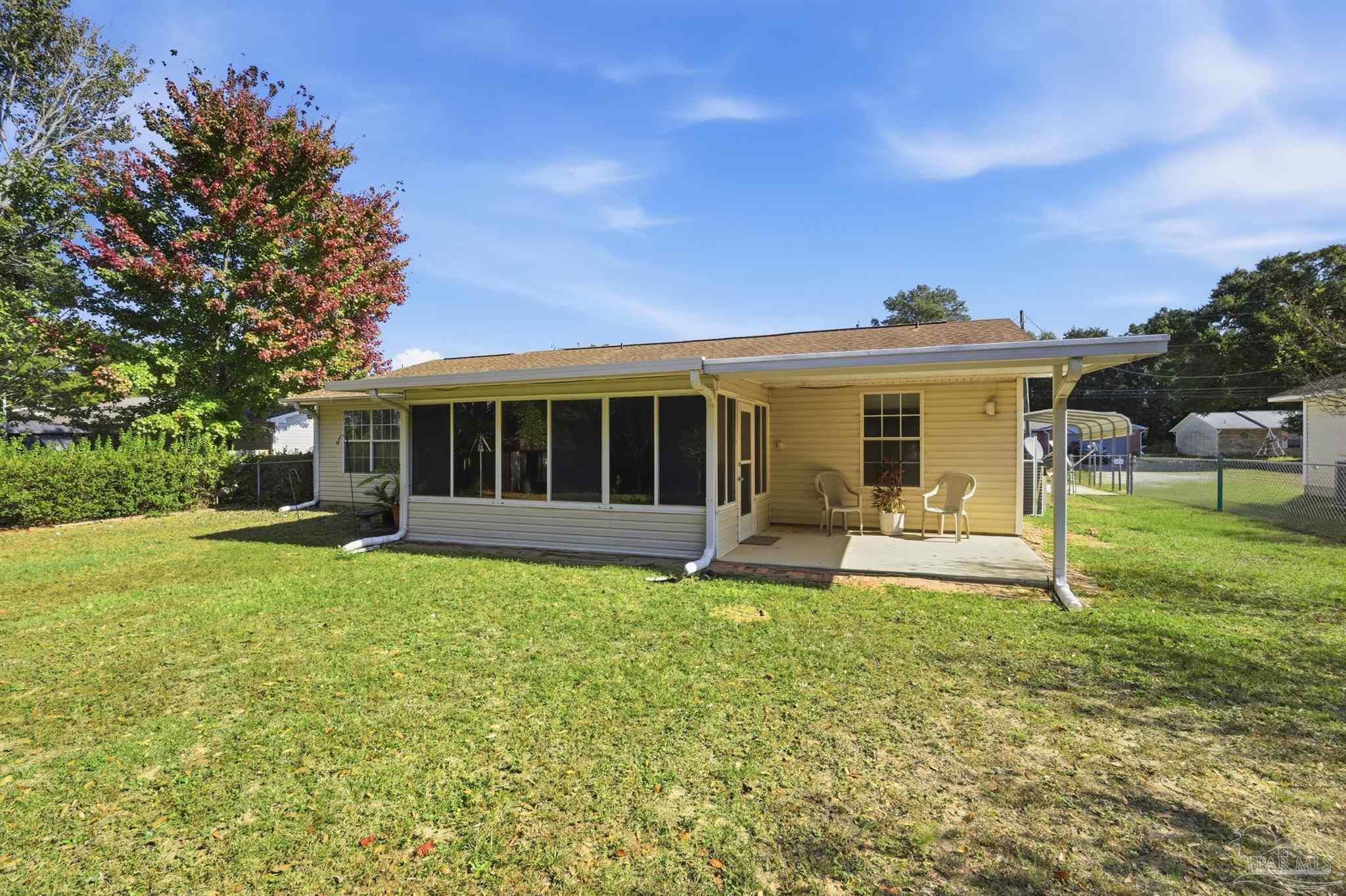 4327 Chantilly Way Milton, FL 32583 - Photo 22 of 32 a view of a house with a yard and sitting area