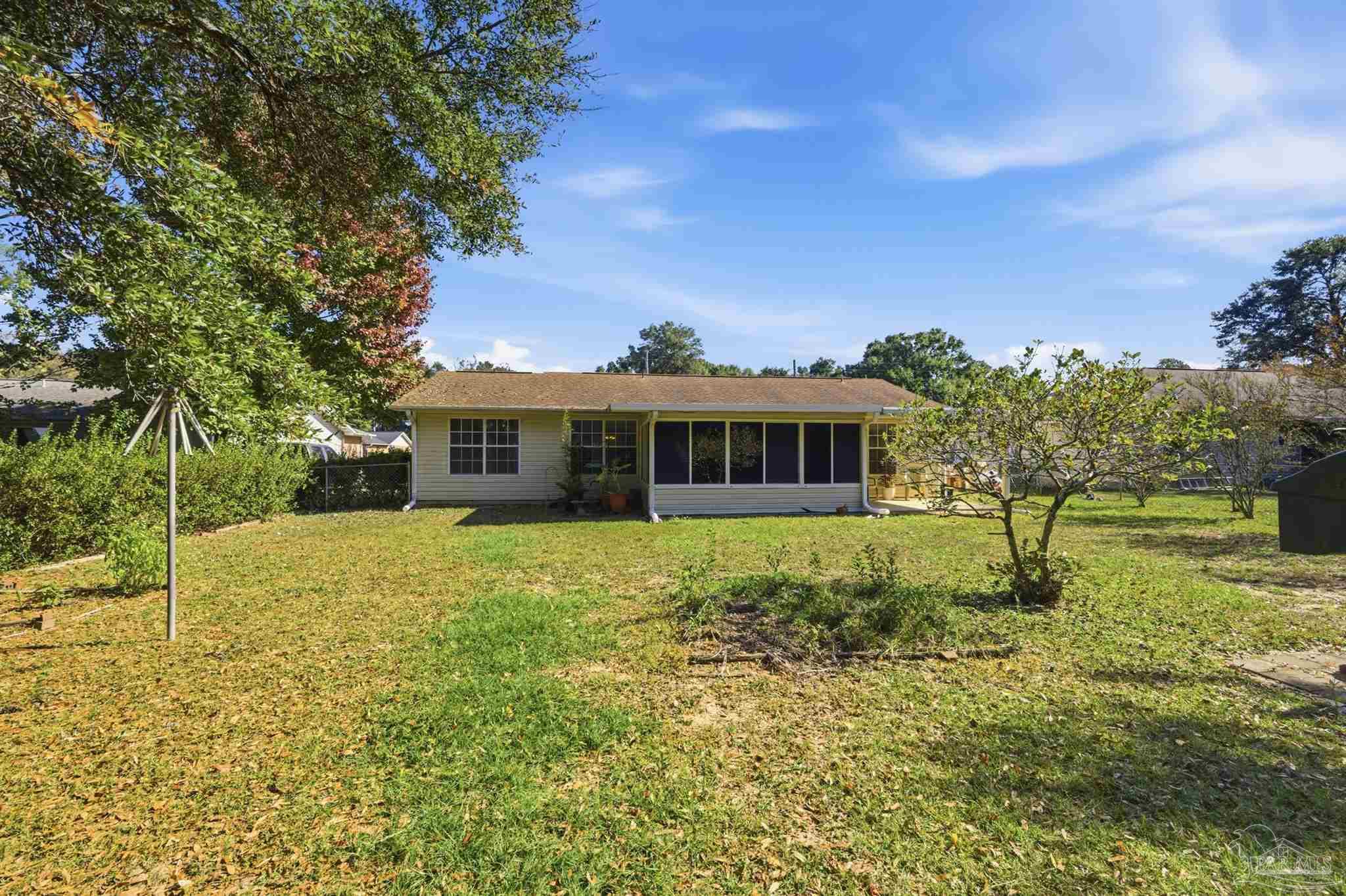 4327 Chantilly Way Milton, FL 32583 - Photo 26 of 32 a front view of a house with a yard