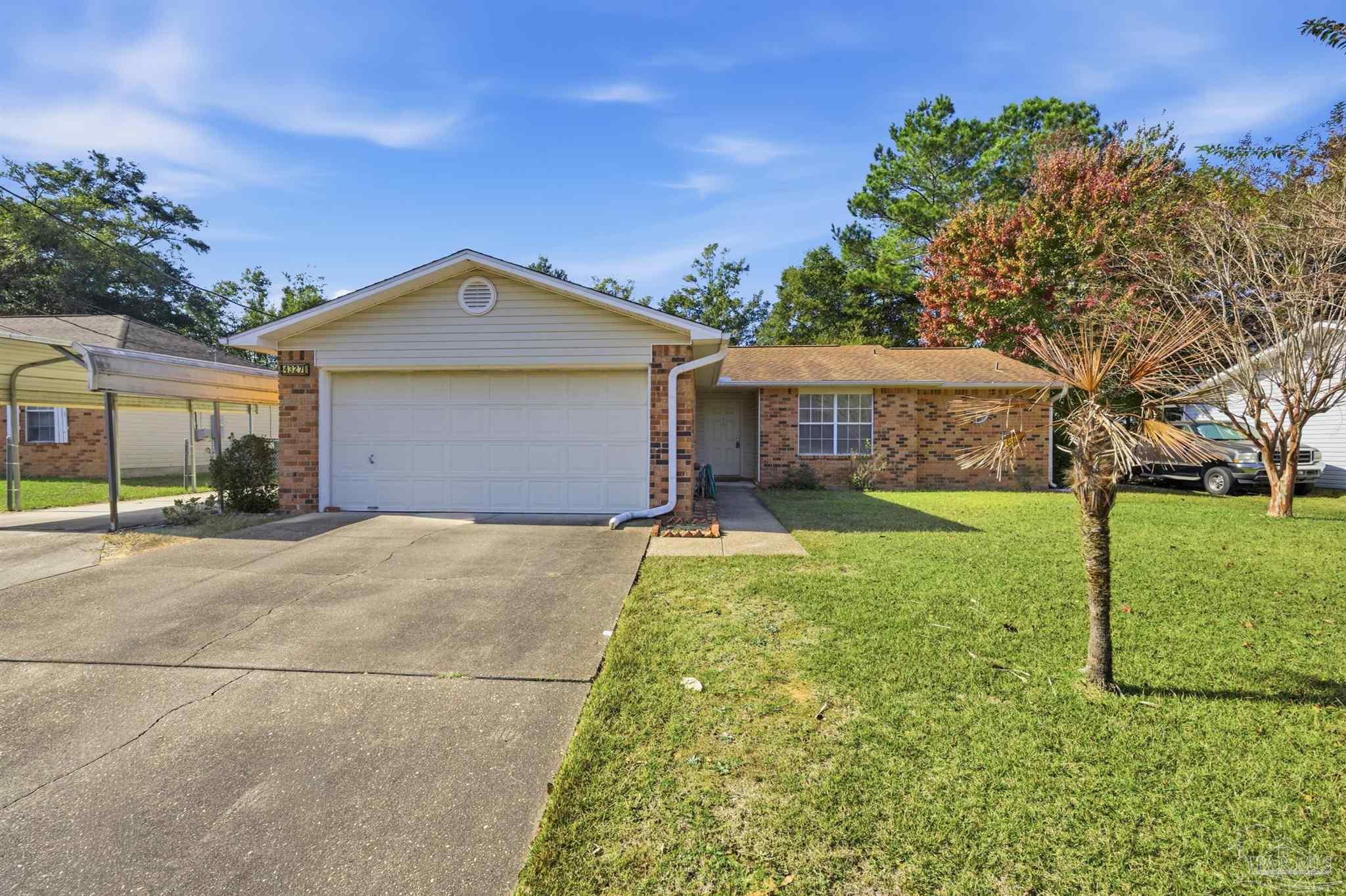 4327 Chantilly Way Milton, FL 32583 - Photo 29 of 32 a front view of a house with a yard