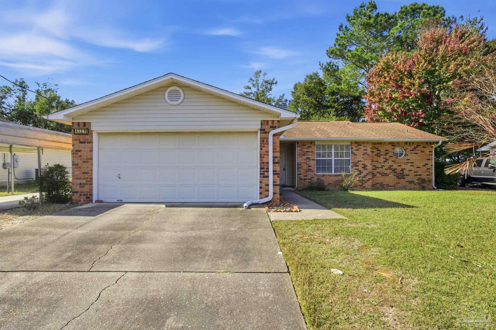 4327 Chantilly Way Milton, FL 32583 - Photo 30 of 32 a front view of a house with garden