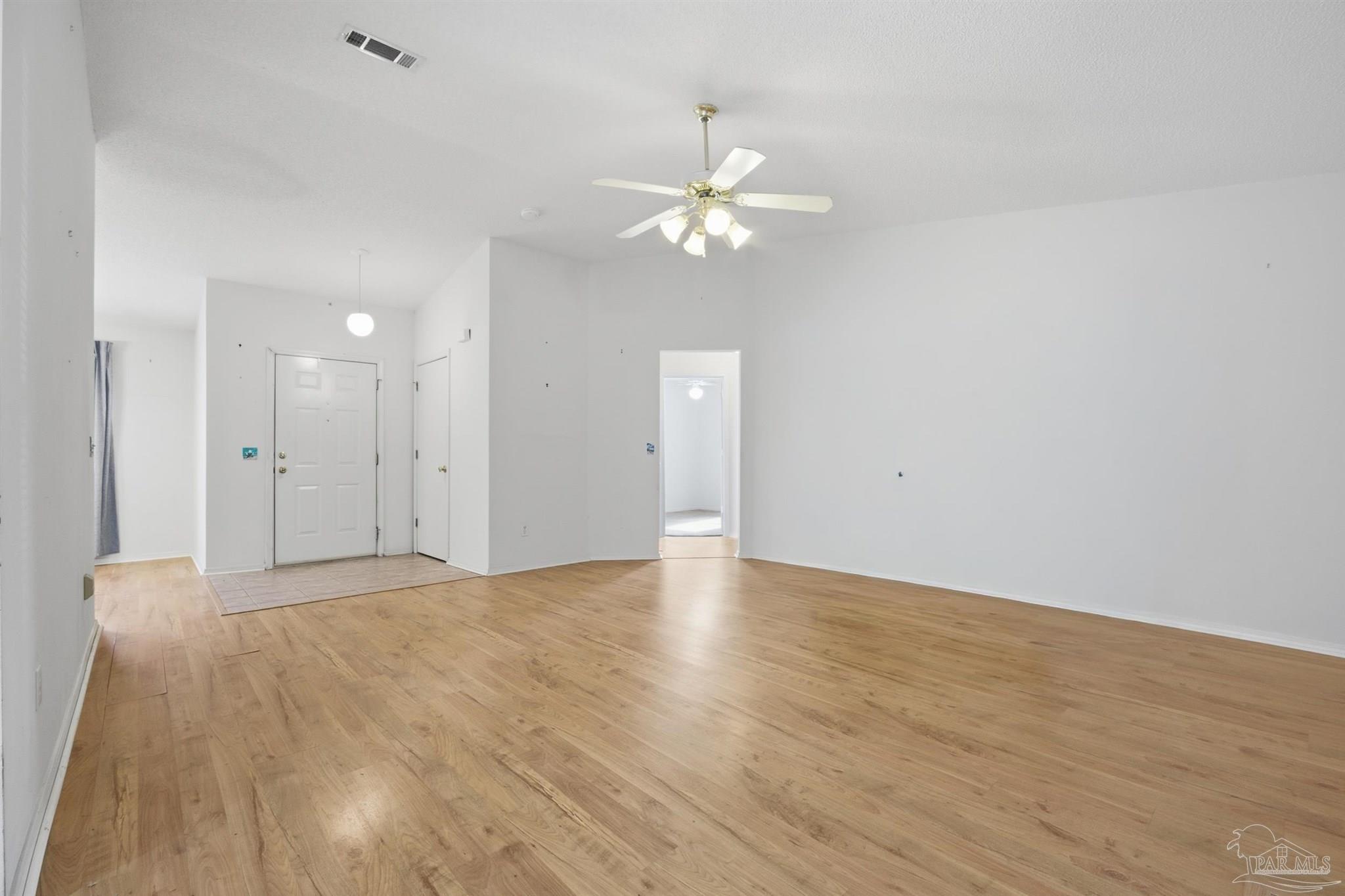 4327 Chantilly Way Milton, FL 32583 - Photo 3 of 32 a view of empty room with wooden floor