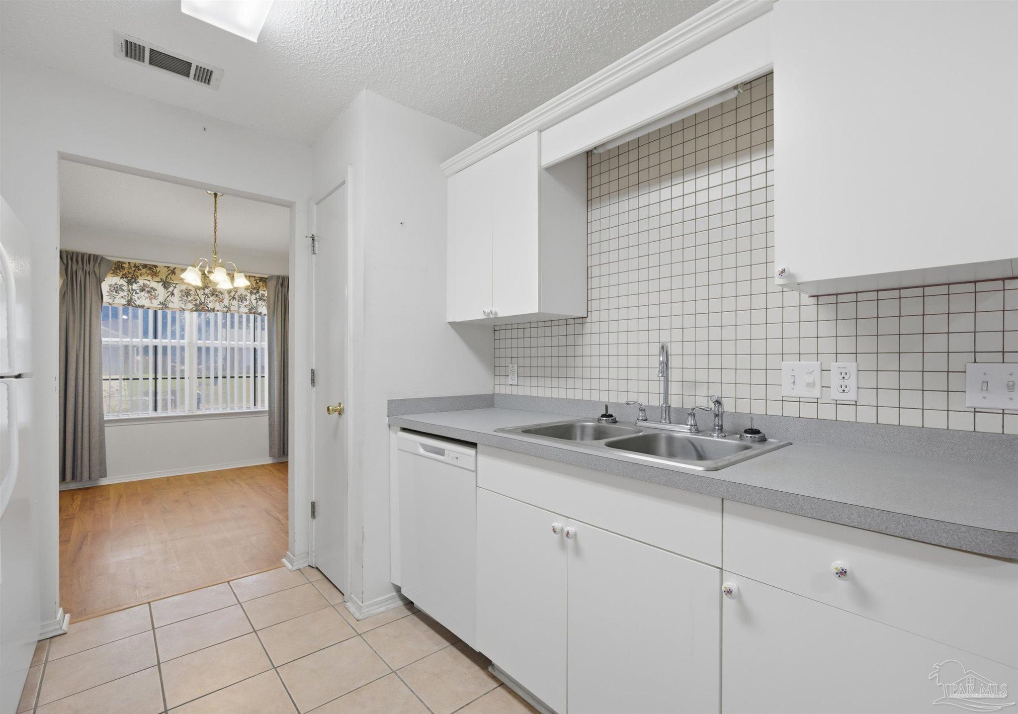 4327 Chantilly Way Milton, FL 32583 - Photo 7 of 32 a bathroom with a sink and a mirror