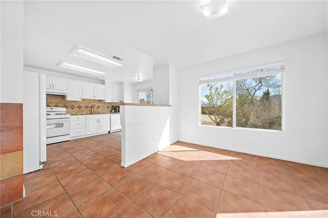 a view of a room with window and wooden floor