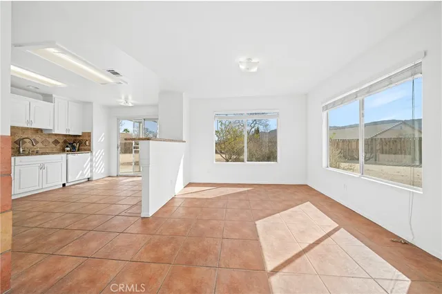 a white refrigerator freezer sitting inside of a kitchen
