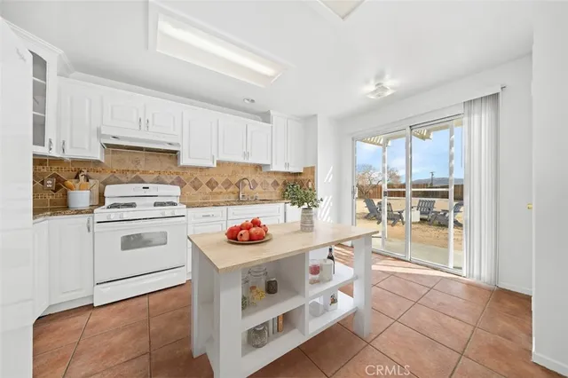a bedroom with a bed and a view of bathroom