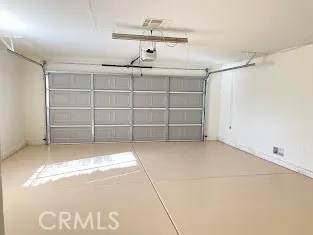 a group of people sitting in front of a house