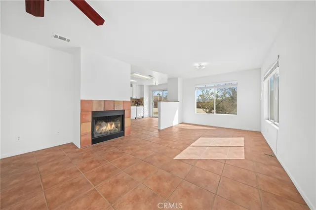 a kitchen with granite countertop a stove top oven sink and cabinets