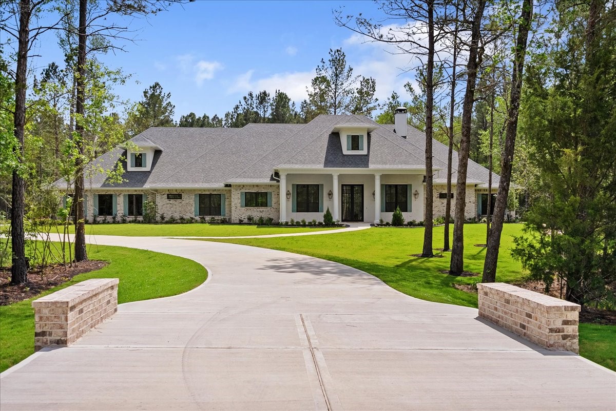 Private winding driveway providing seclusion and security.