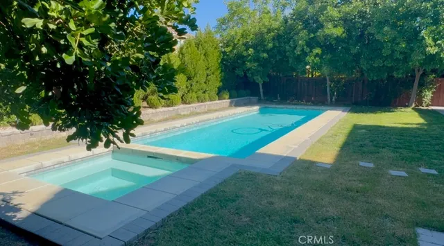 a view of a backyard with a small cabin