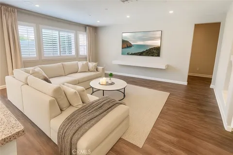 a spacious bedroom with a bed and a large window