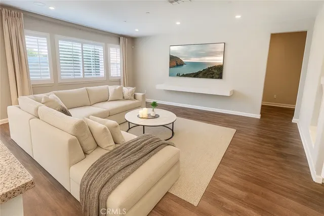 a spacious bedroom with a bed and a large window