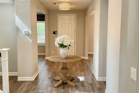 a view of kitchen with furniture and wooden floor