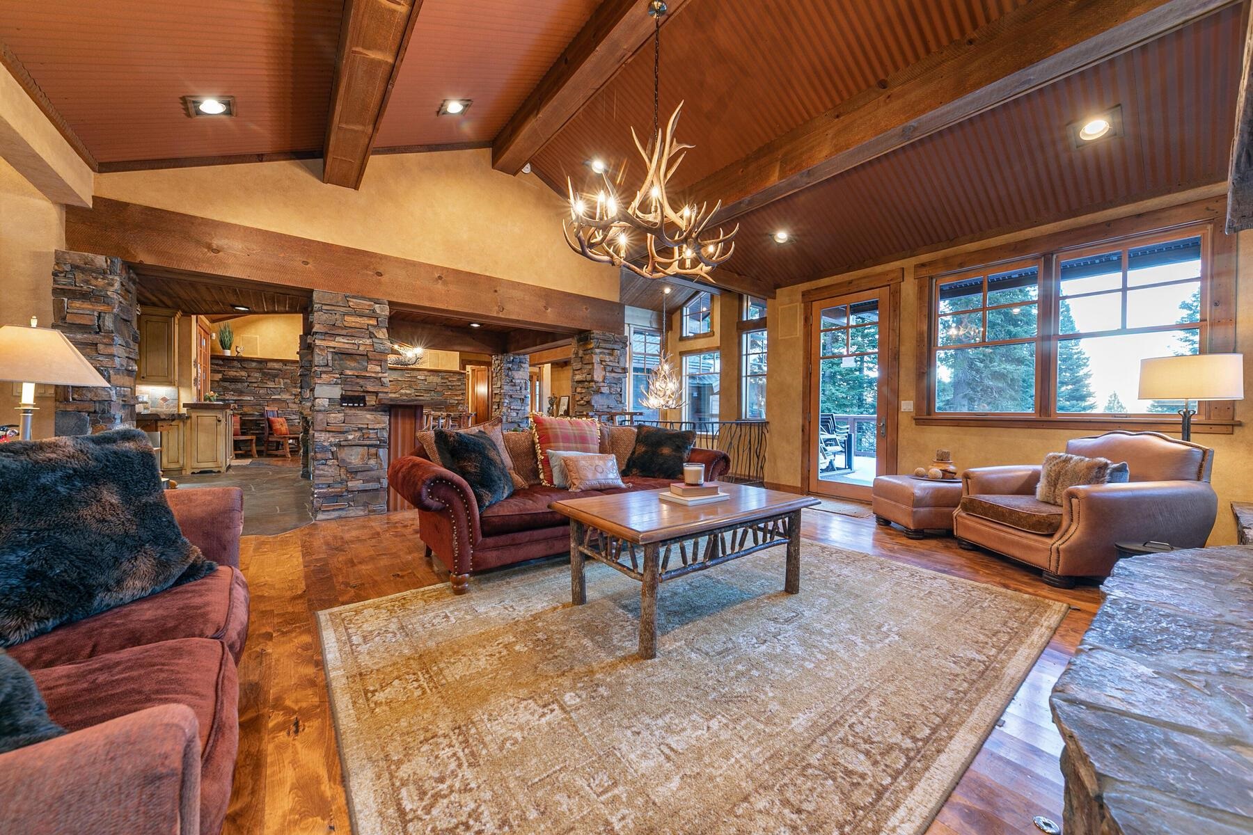1768 Grouse Ridge Road Truckee, CA 96161 - Photo 9 of 28 a living room with furniture and a chandelier