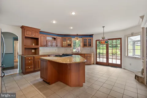 a kitchen with stainless steel appliances granite countertop a stove and a refrigerator