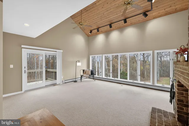 a kitchen with granite countertop a sink stove and refrigerator