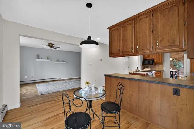 a bathroom with a tub a sink and shower