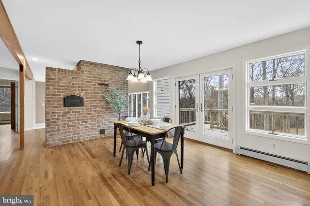 a view of an empty room with brick walls