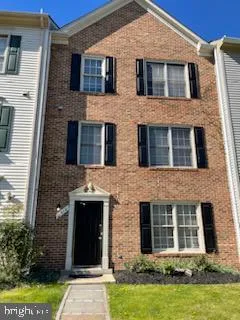 a front view of a house with yard