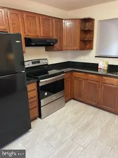 a kitchen with a cabinets and appliances