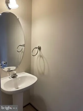 a bathroom with a sink and mirror