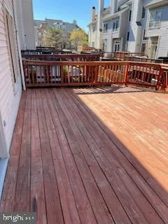 a view of a balcony with wooden floor and city view