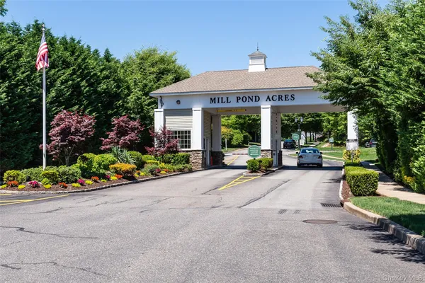 a front view of a house with a yard and outdoor seating