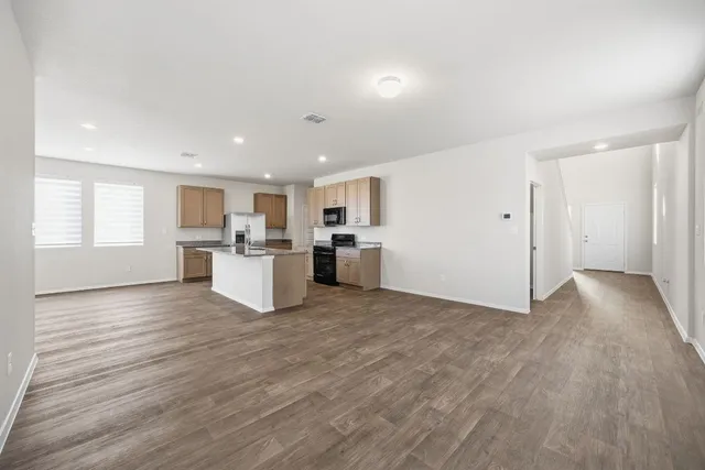 a view of kitchen with wooden floor