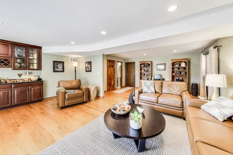a view of a kitchen with stainless steel appliances granite countertop a stove and a microwave