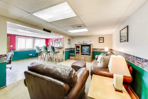 a view of a dining room with furniture wooden floor and a rug