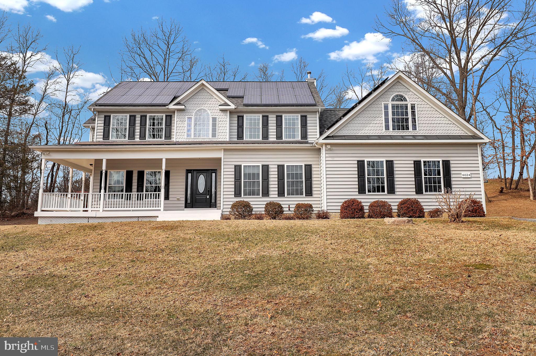 6024 Old Bohn Road Mount Airy, MD 21771 - Photo 1 of 46 a front view of a house with a yard