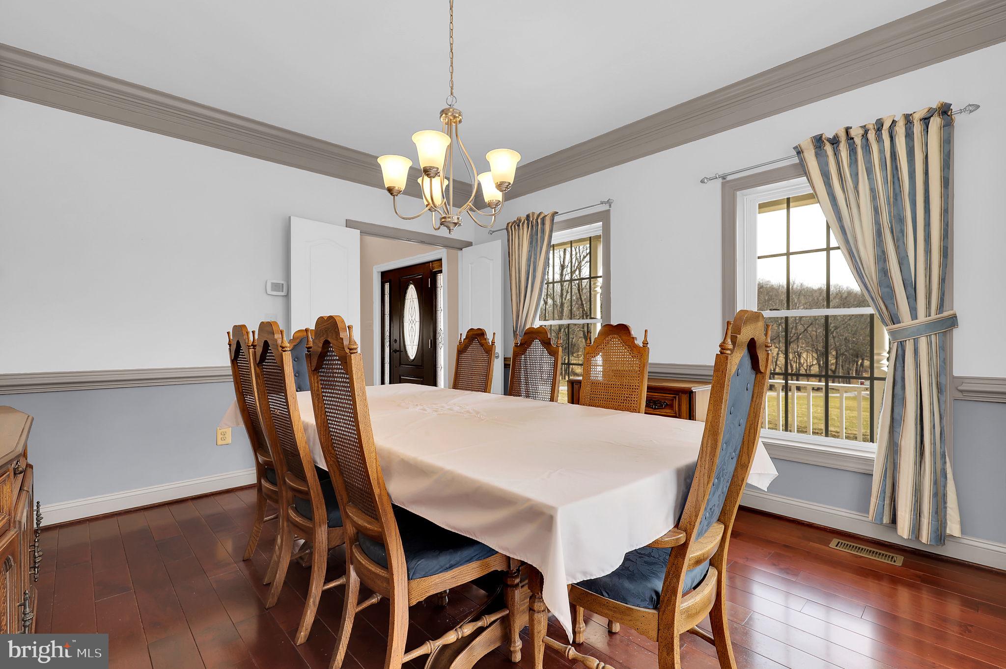 6024 Old Bohn Road Mount Airy, MD 21771 - Photo 11 of 46 a view of a dining room with furniture window and wooden floor