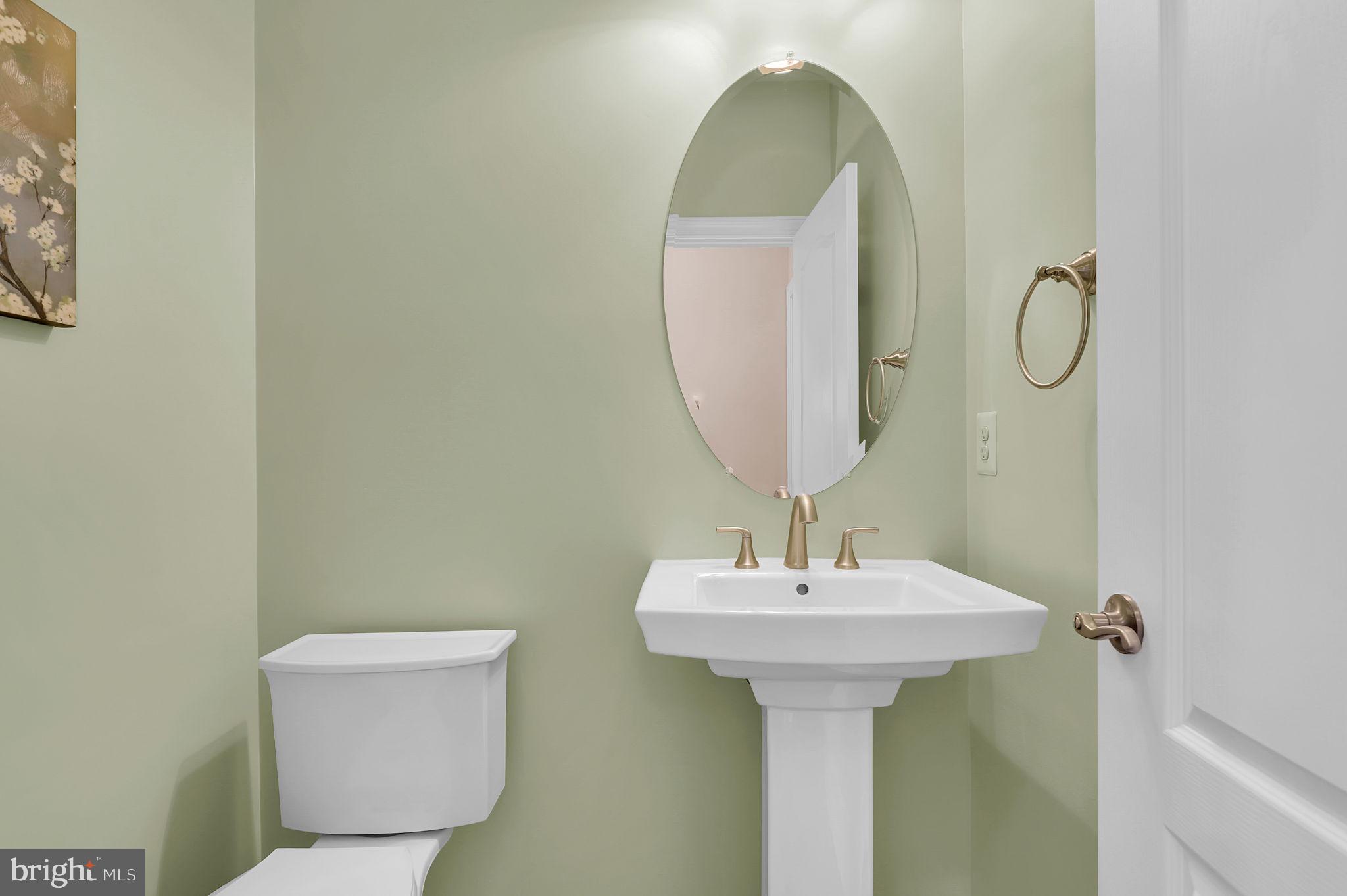 6024 Old Bohn Road Mount Airy, MD 21771 - Photo 24 of 46 a bathroom with a sink toilet and a mirror